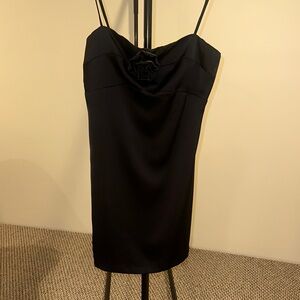 Chic Black Spaghetti Strap Dress with Floral Accent